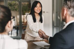 Two people discussing addiction treatment center jobs