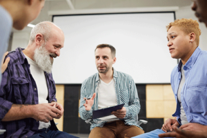 A small group of people participate in an opioid treatment program.