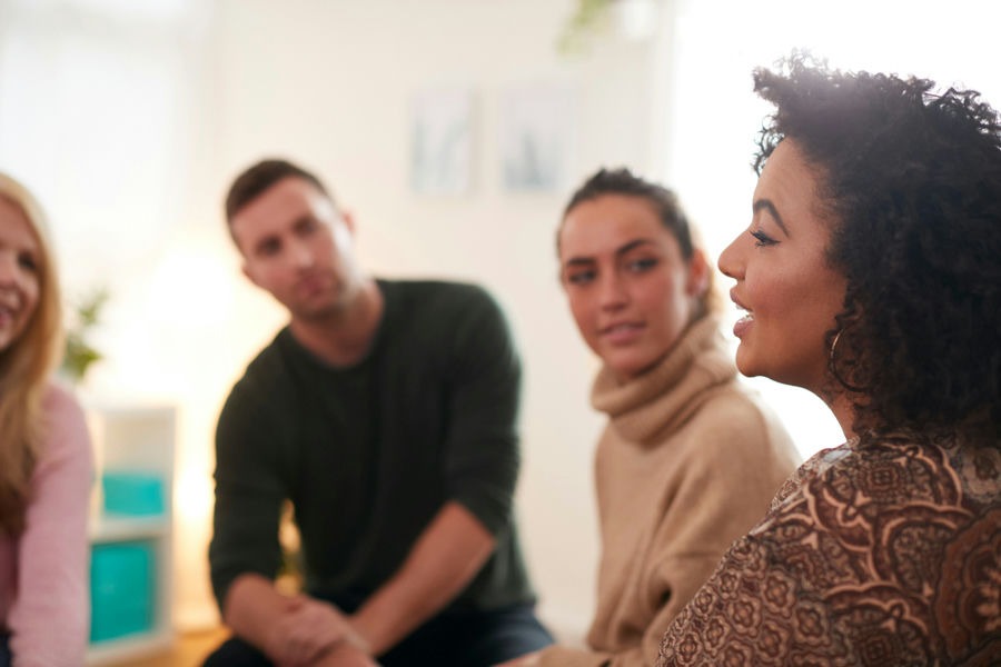 woman talking in group therapy