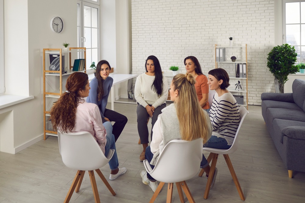 Group of women in a therapy session at a residential treatment center